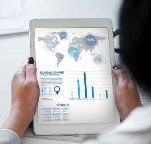 turned on white tablet computer at globe share graph