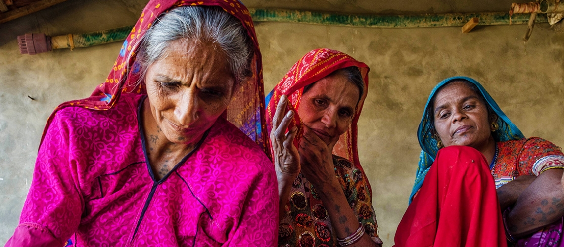women-artisans-members-from-barara-village-of-patan-districts-doing-traditional-painting-on-cloth-to-prepare-for-embroidery-for-sewa-hansiba-product._