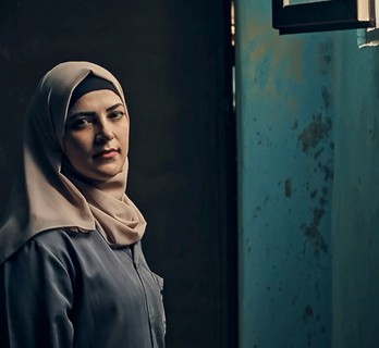 Woman-standing-by-an-open-window-PS4R-square_348x320